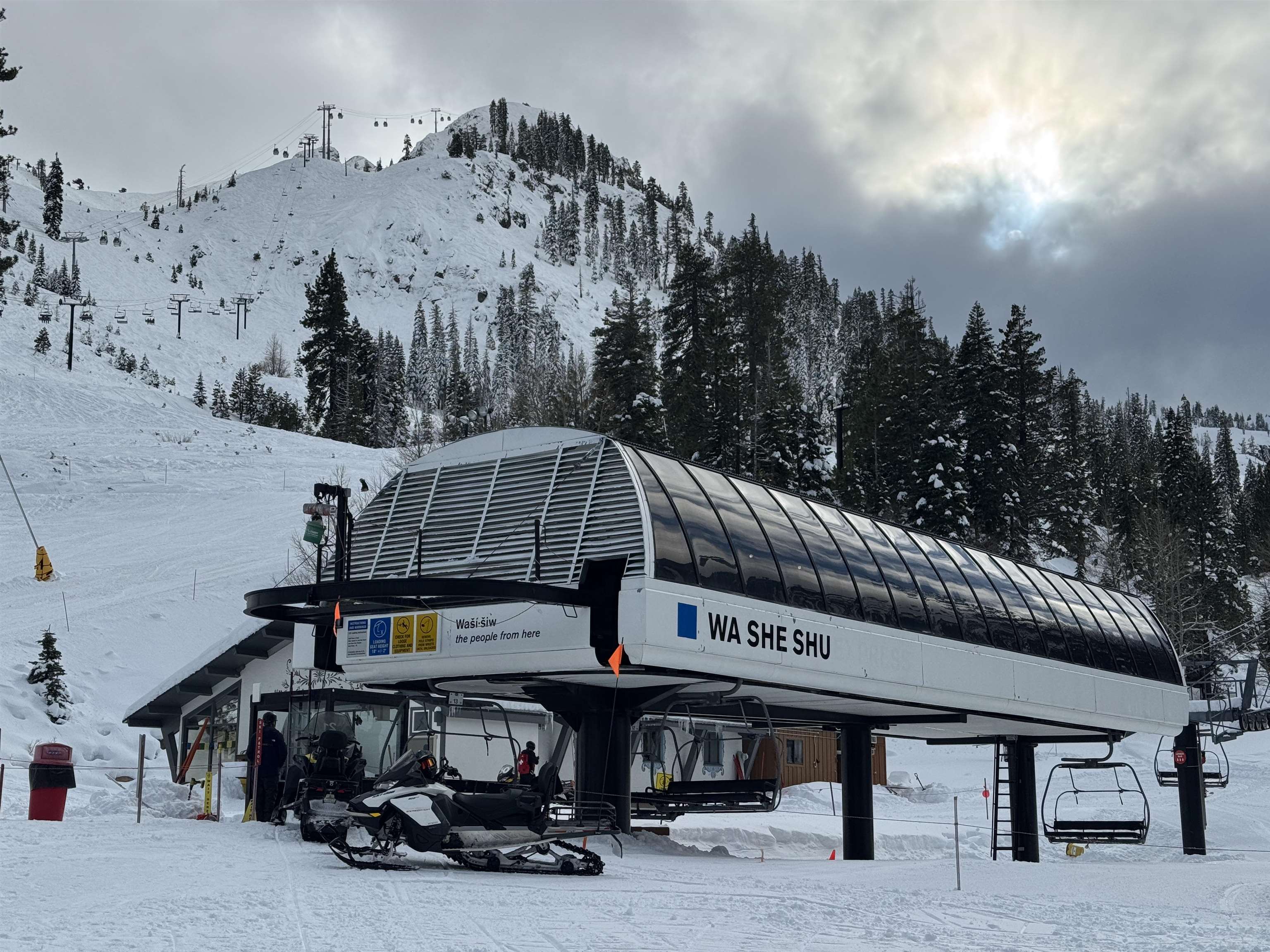 a view of a roof deck with table and chairs with wooden floor and fence