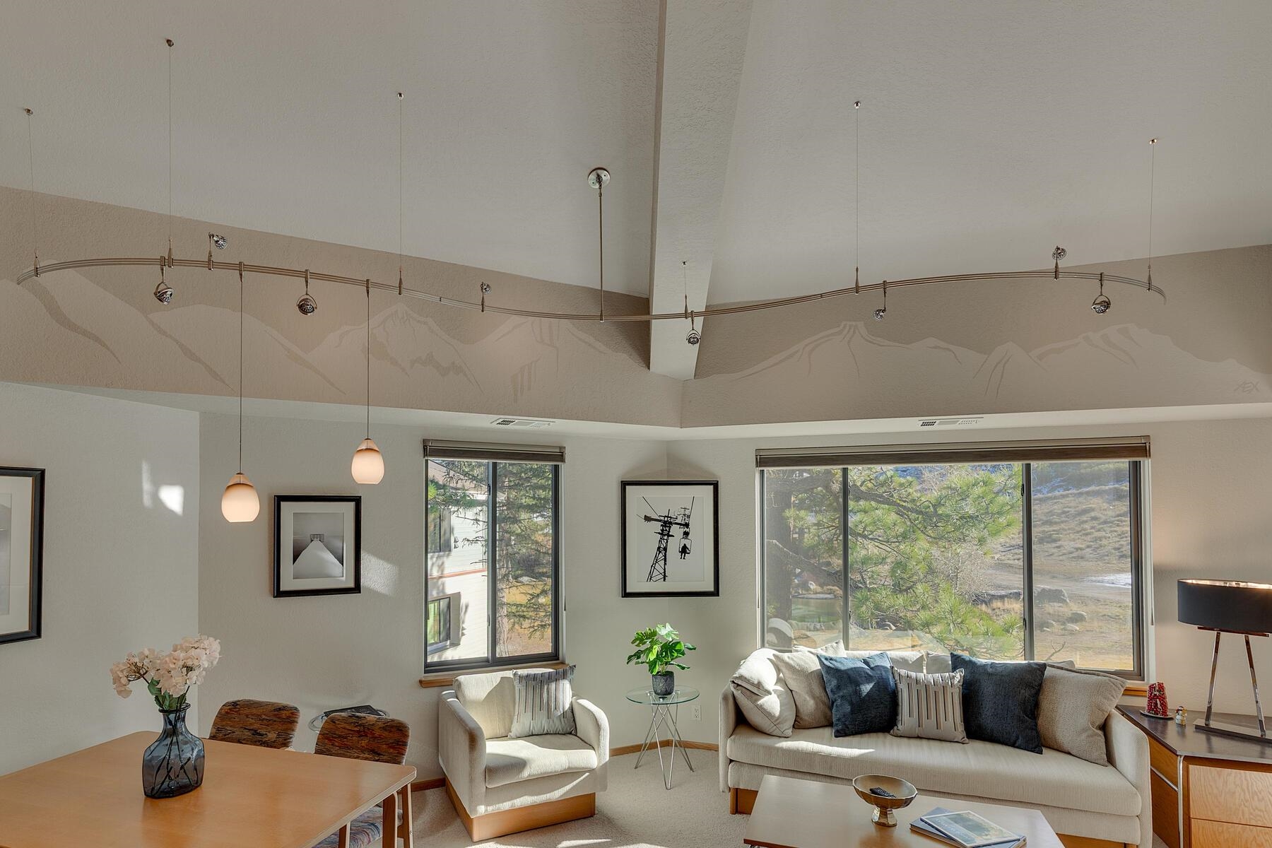 201 Shirley Cyn Road, Unit 302 Olympic Valley, CA 96146 - Photo 11 of 28 a living room with furniture and a large window