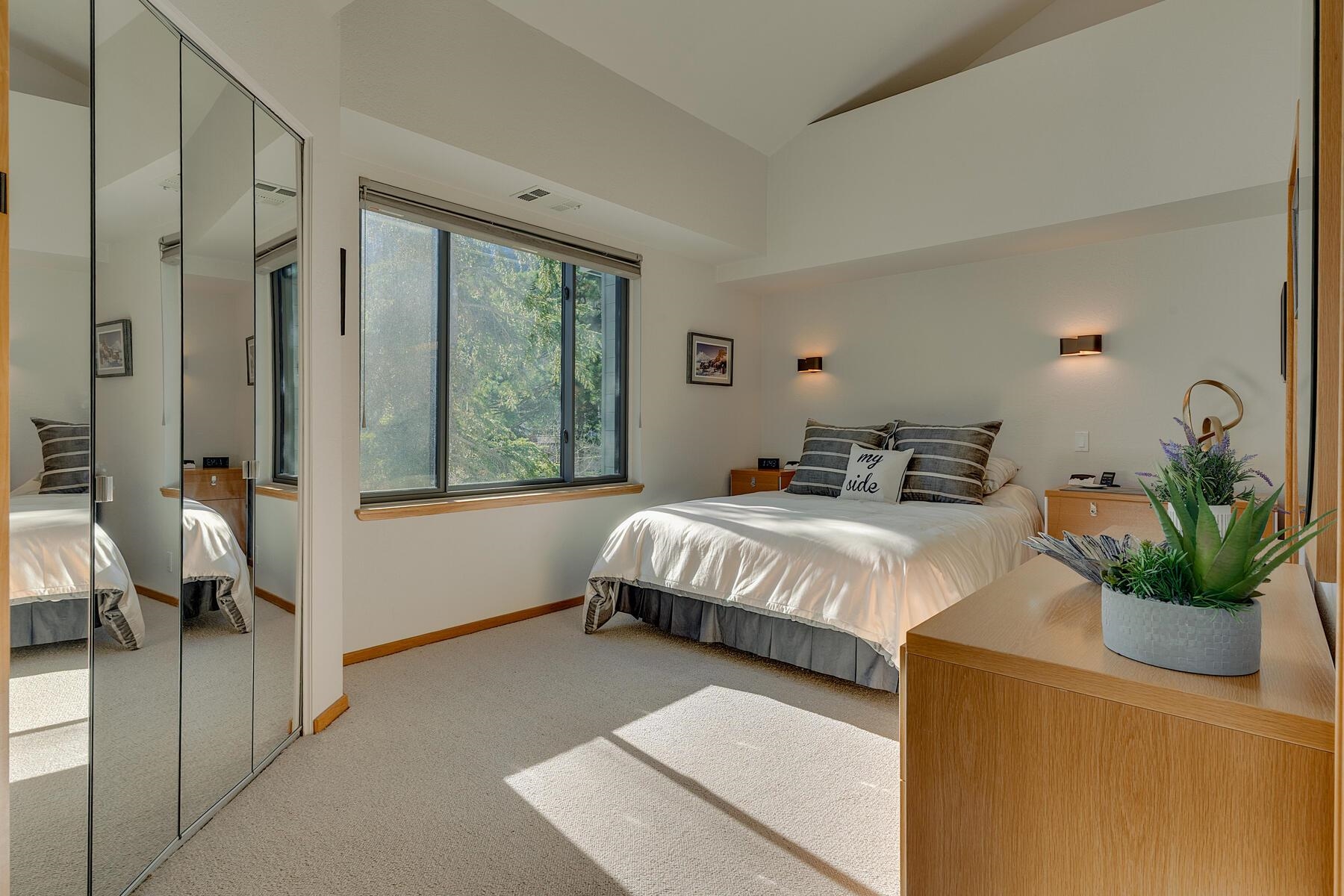 201 Shirley Cyn Road, Unit 302 Olympic Valley, CA 96146 - Photo 12 of 28 a bedroom with a bed and large window