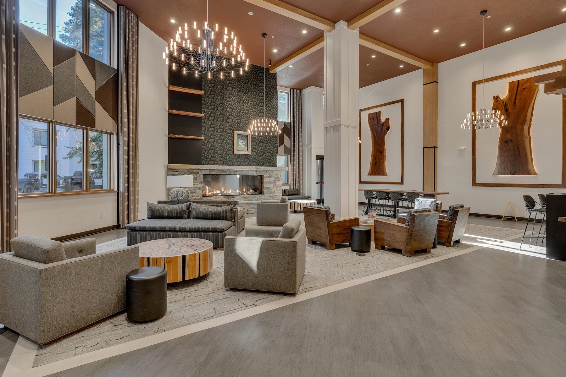 201 Shirley Cyn Road, Unit 302 Olympic Valley, CA 96146 - Photo 18 of 28 a living room with furniture and a chandelier