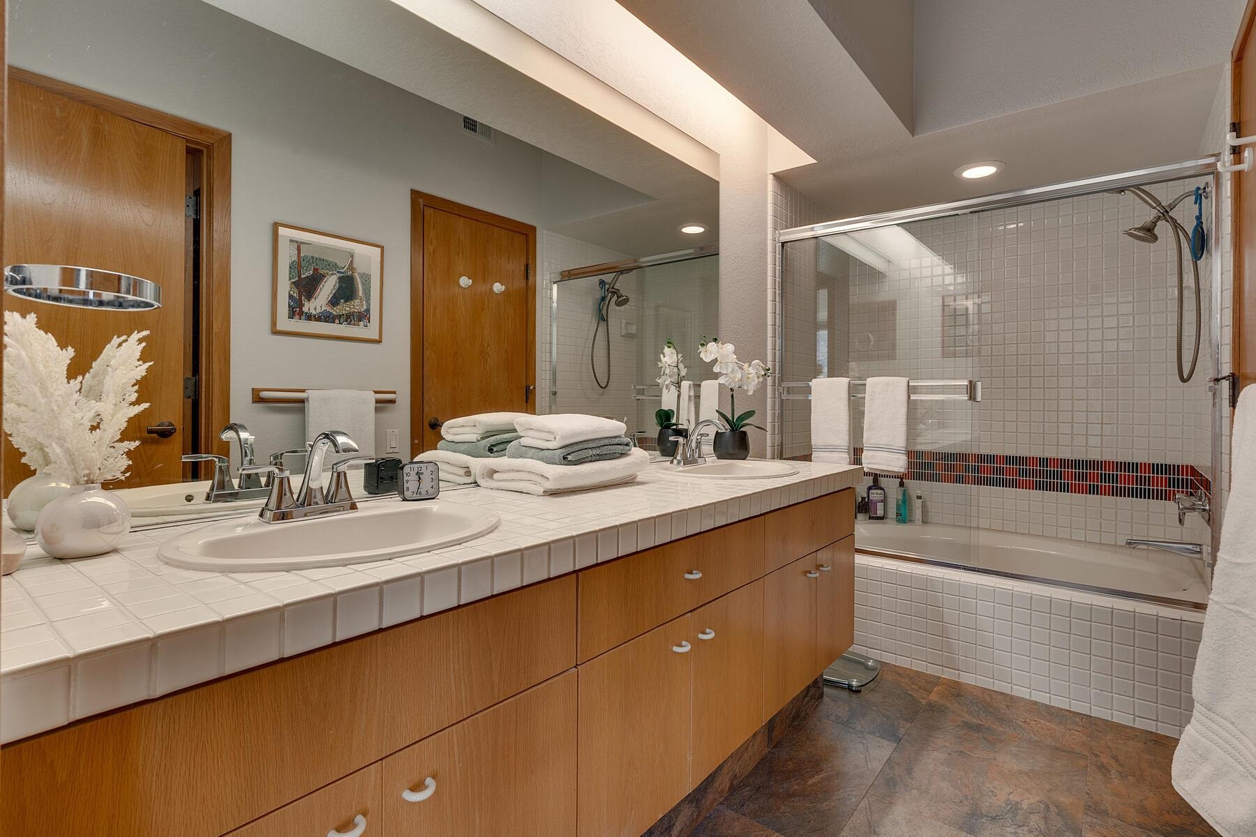 201 Shirley Cyn Road, Unit 302 Olympic Valley, CA 96146 - Photo 19 of 28 a bathroom with a double vanity sink mirror and double