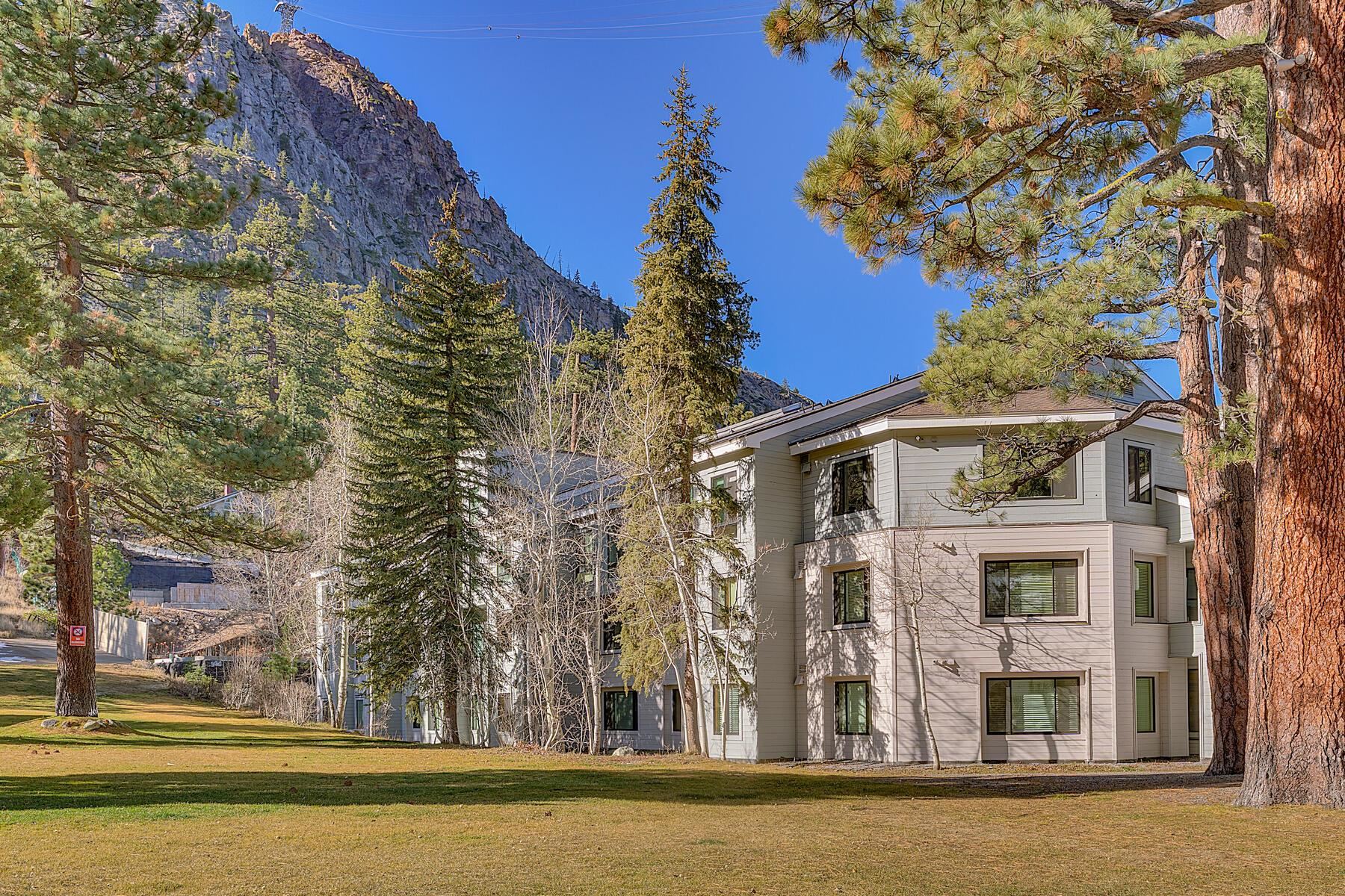 201 Shirley Cyn Road, Unit 302 Olympic Valley, CA 96146 - Photo 2 of 28 a front view of a building with a garden