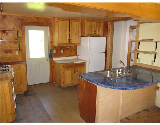 56 Head Of The Tide Road Belfast, ME 04915 - Photo 5 of 19 Kitchen. Back door leads to yard and...