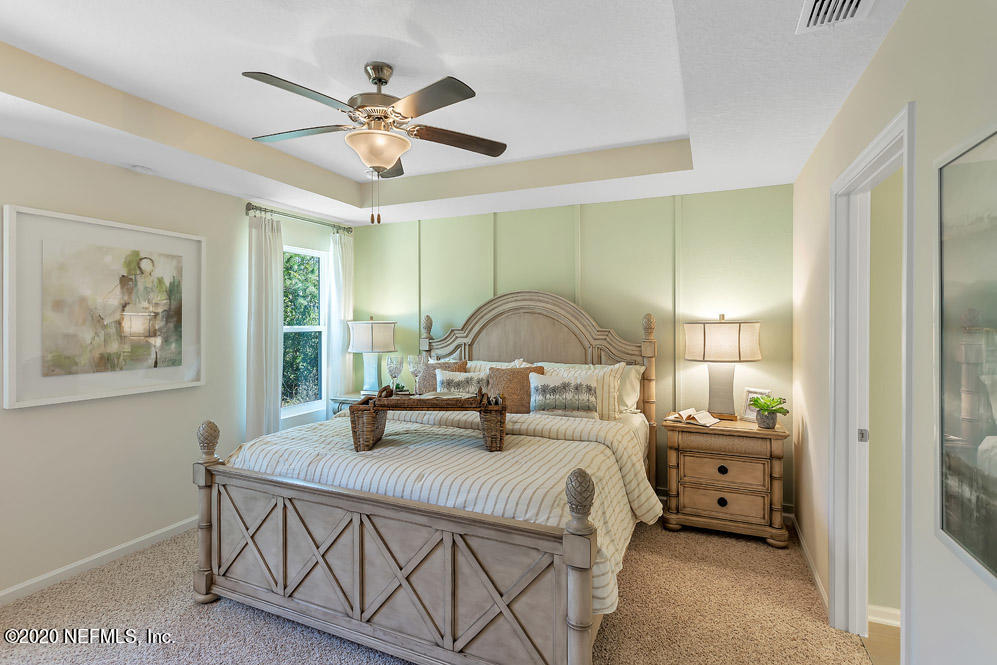 100 Palace Drive St. Augustine, FL 32084 - Photo 10 of 27 a bedroom with a bed and window