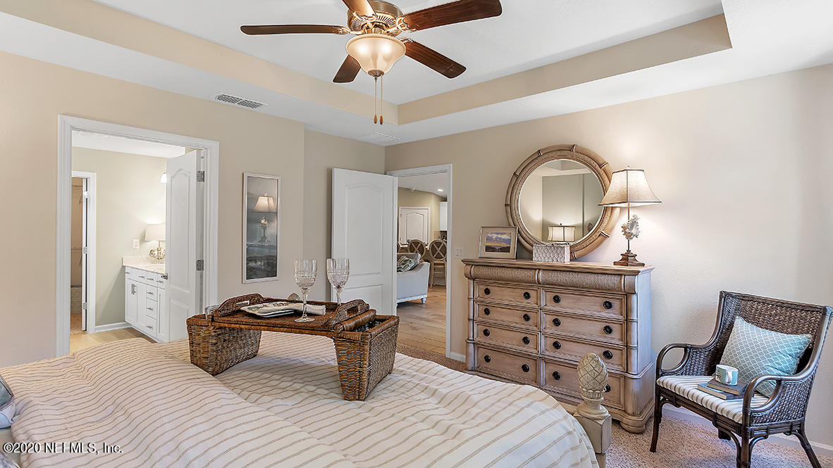 100 Palace Drive St. Augustine, FL 32084 - Photo 11 of 27 a bedroom with furniture and a mirror