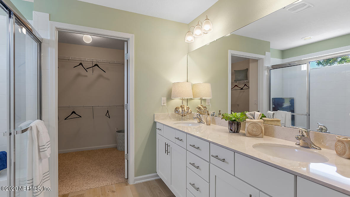 100 Palace Drive St. Augustine, FL 32084 - Photo 12 of 27 a bathroom with a double vanity sink mirror and shower
