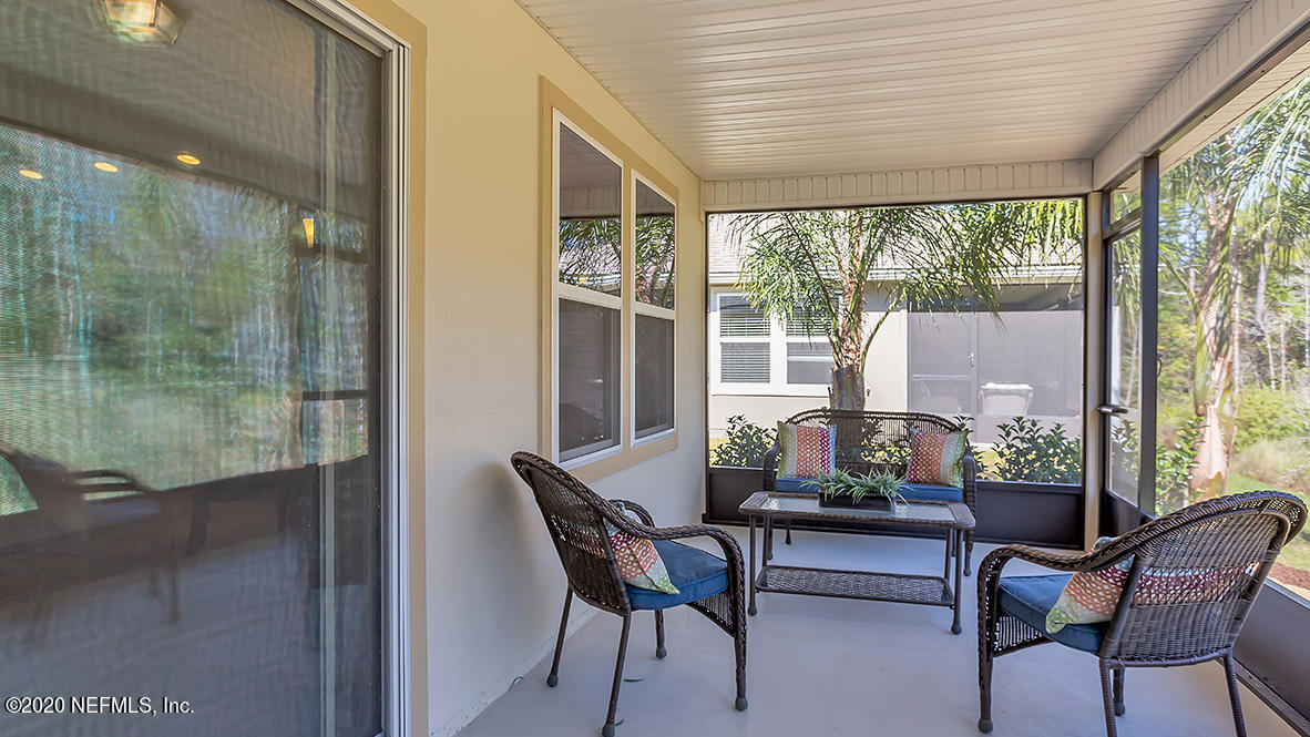 100 Palace Drive St. Augustine, FL 32084 - Photo 16 of 27 a dining room with furniture and a floor to ceiling window