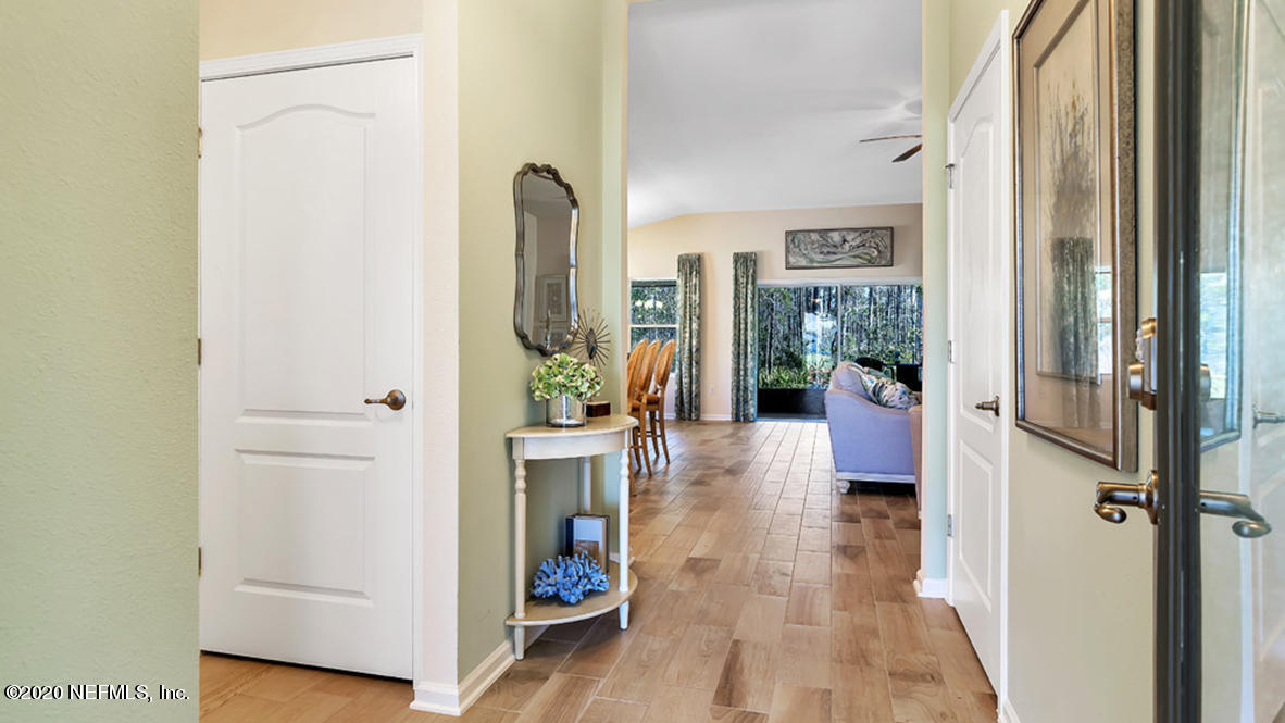 100 Palace Drive St. Augustine, FL 32084 - Photo 2 of 27 a view of a hallway with a livingroom and furniture
