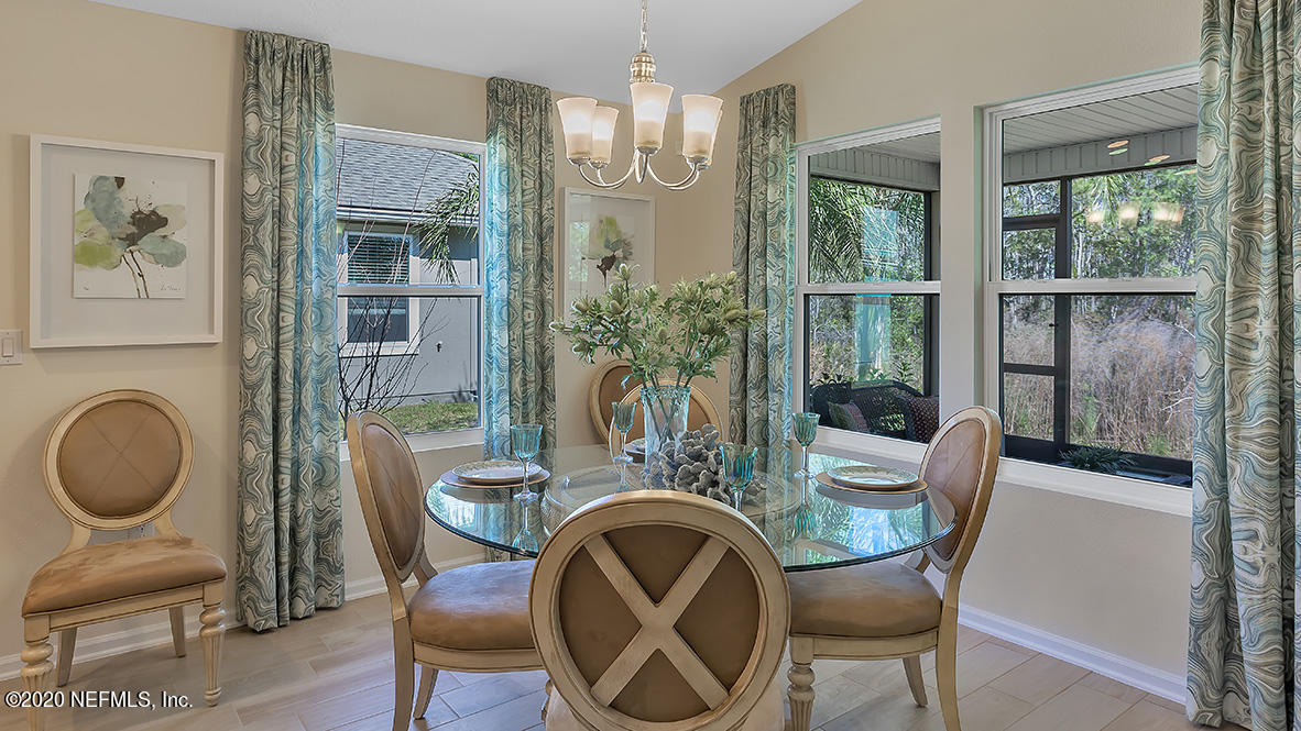 100 Palace Drive St. Augustine, FL 32084 - Photo 6 of 27 a dining room with furniture a window and wooden floor