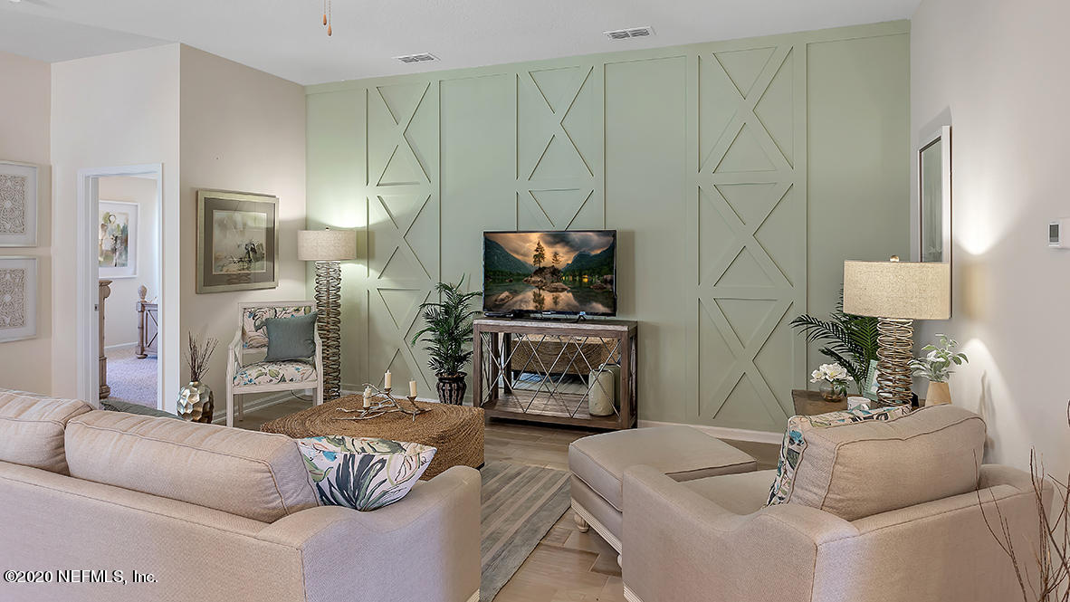 100 Palace Drive St. Augustine, FL 32084 - Photo 7 of 27 a living room with furniture and a fireplace