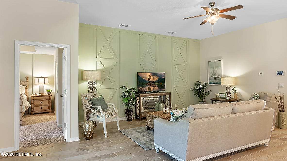 100 Palace Drive St. Augustine, FL 32084 - Photo 8 of 27 a living room with furniture and a flat screen tv