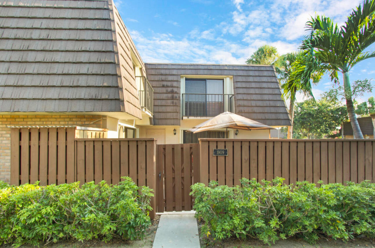 a backyard of a house with a garden