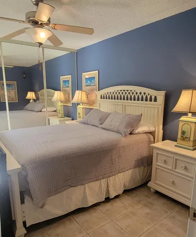 a bedroom with a bed and a television