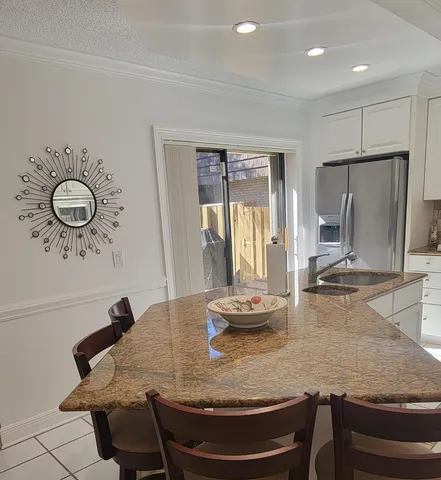 a view of a dining table and chairs