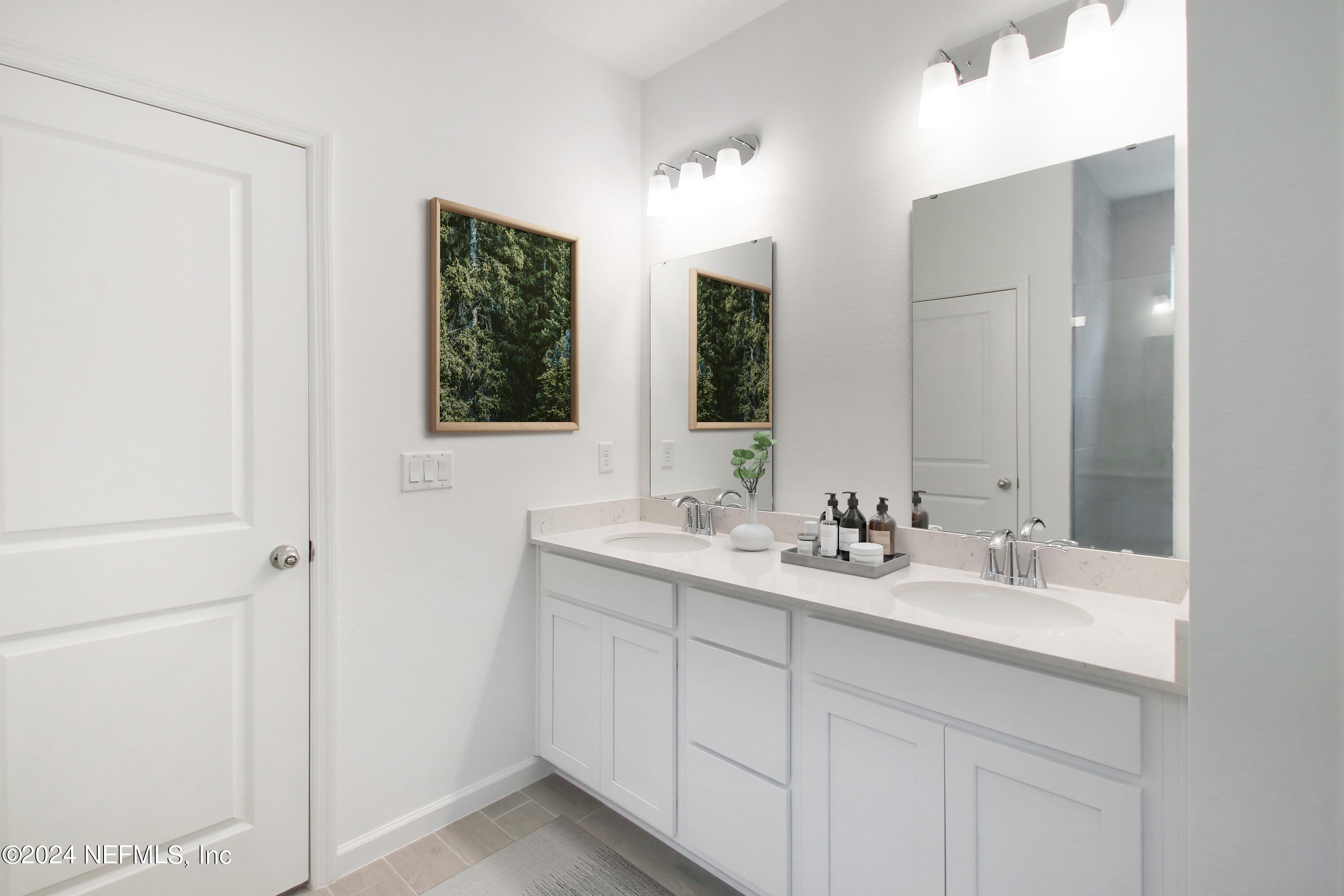 45 Walloon Cove St. Augustine, FL 32092 - Photo 25 of 32 a bathroom with 2 sink and a mirror