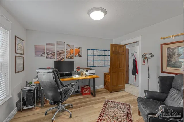 a workspace with furniture and a window