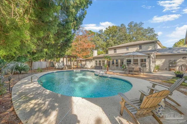 a view of a house with swimming pool
