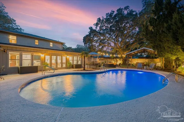 a view of swimming pool with outdoor seating