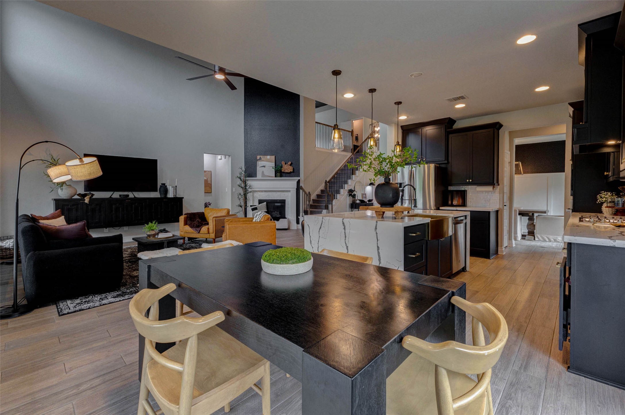 4303 Tupelo Leaf Court Manvel, TX 77578 - Photo 20 of 50 a kitchen with a table chairs refrigerator and microwave