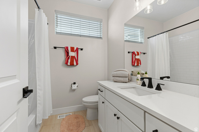 839 Walker Way St. George, UT 84770 - Photo 32 of 32 Bathroom featuring a wide single vanity with white countertop, undermount sink, and matte black faucet