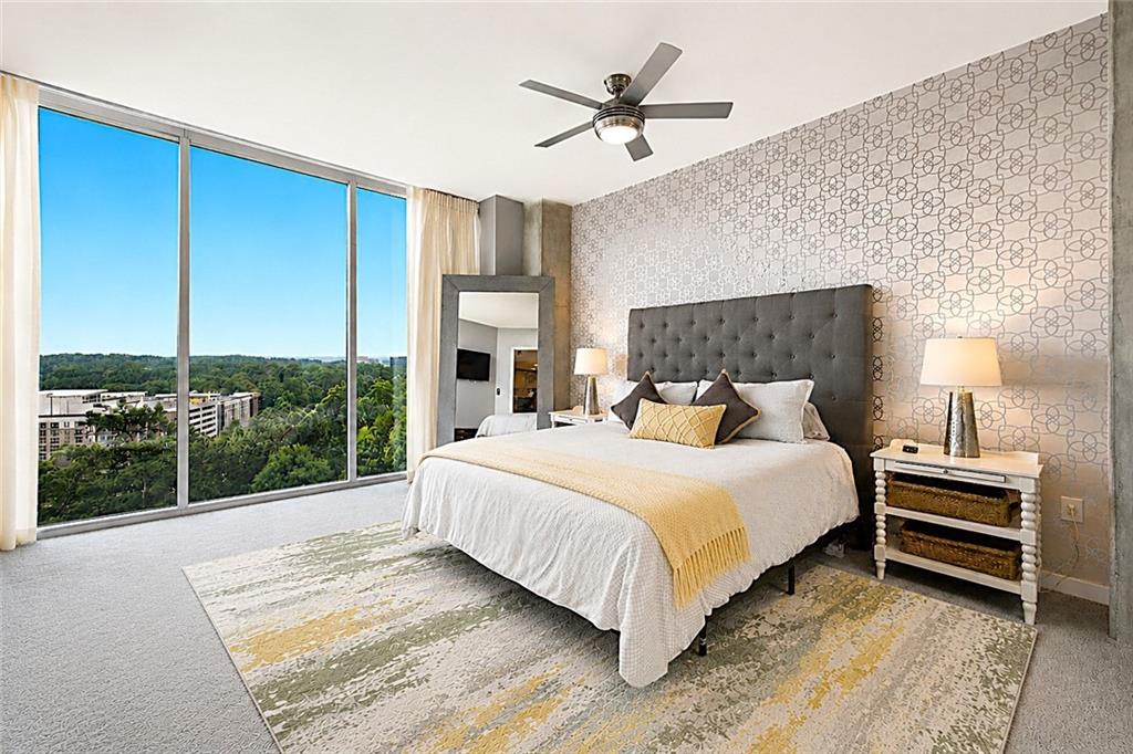 3300 Windy Ridge Parkway Southeast, Unit 1112 Atlanta, GA 30339 - Photo 19 of 43 a bedroom with a large bed and a window