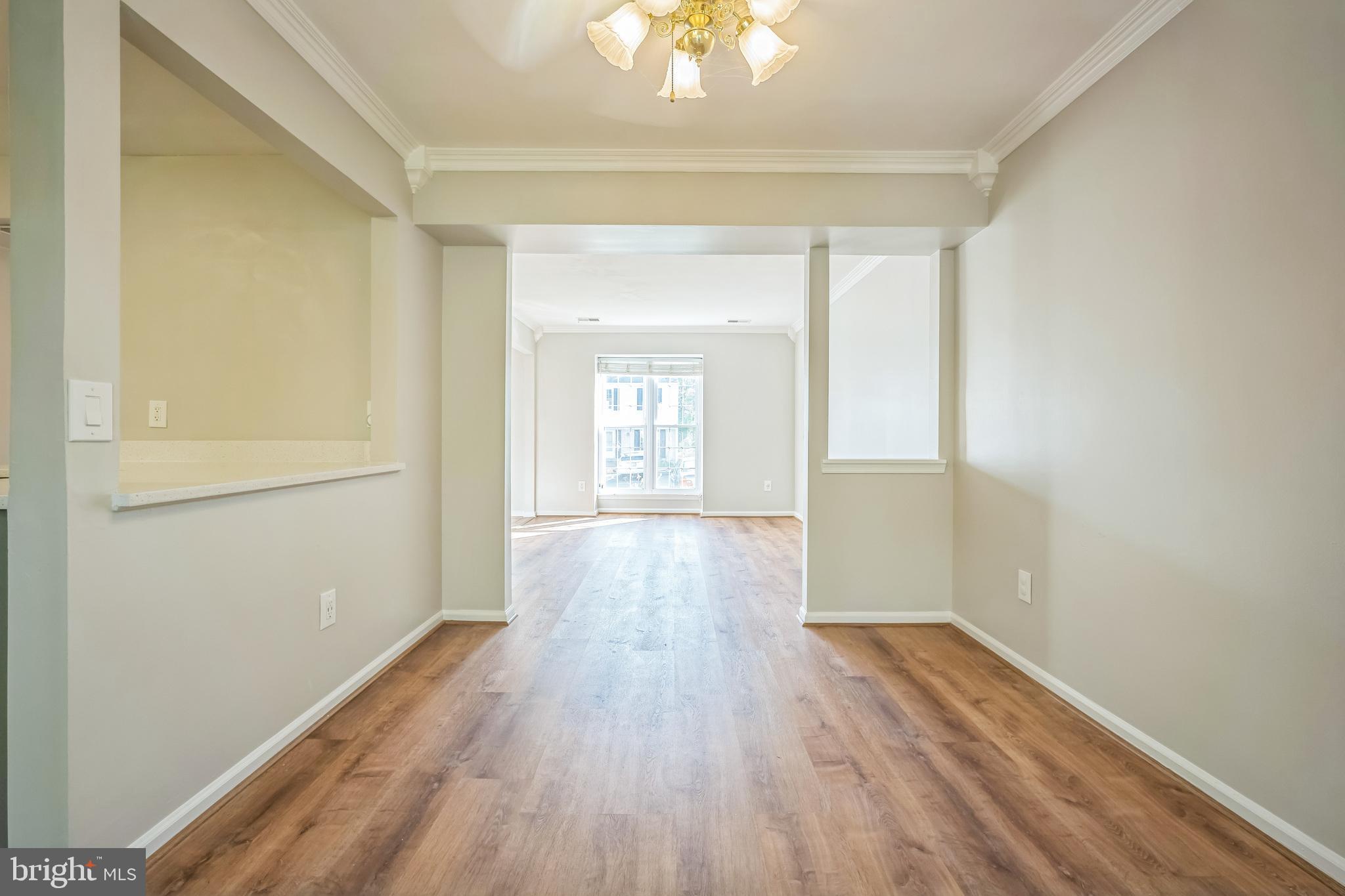 14801 Basingstoke Loop Centreville, VA 20120 - Photo 21 of 28 a view of wooden floor and windows in a room