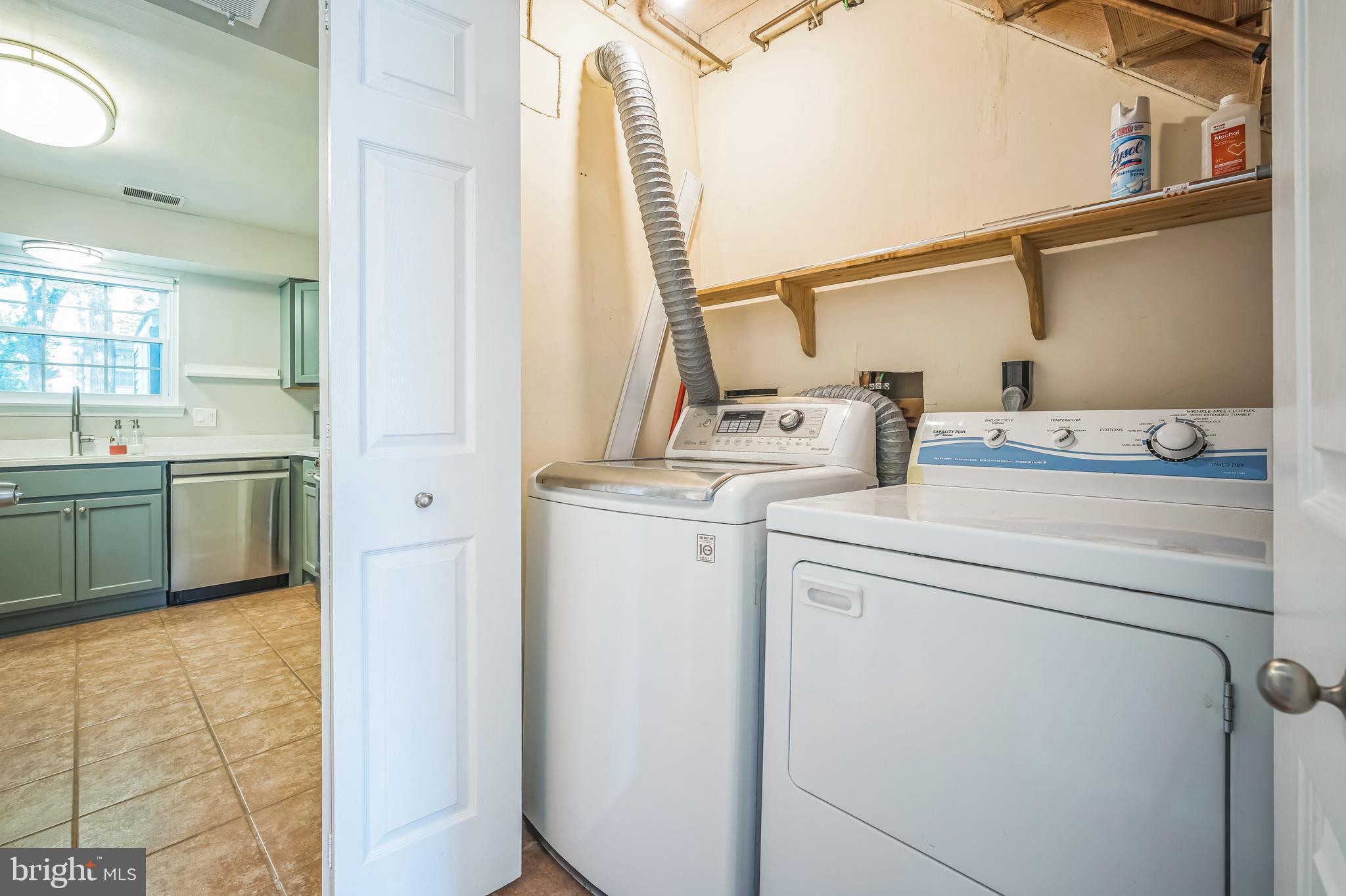 14801 Basingstoke Loop Centreville, VA 20120 - Photo 24 of 28 a utility room with dryer and washer