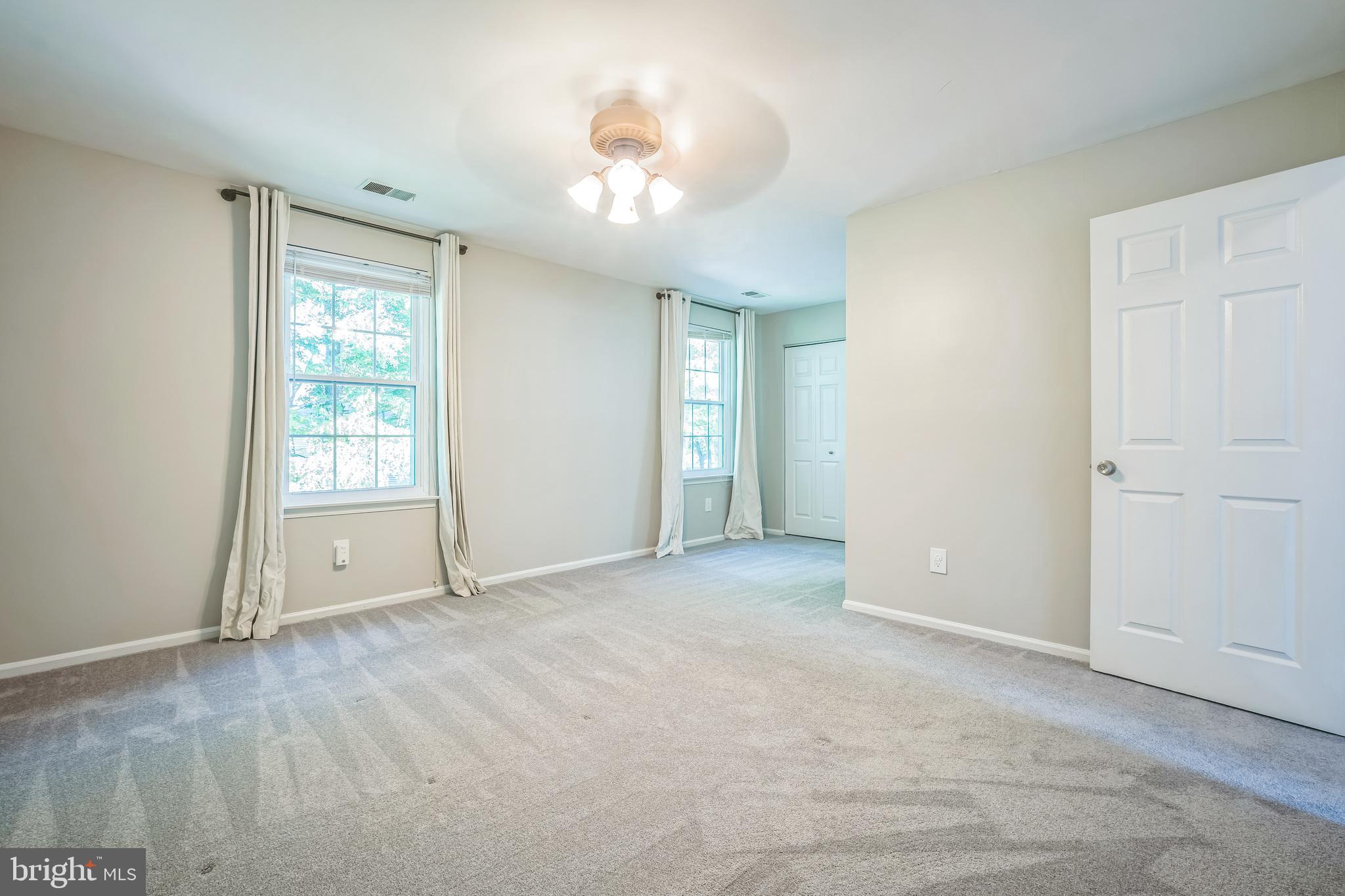 14801 Basingstoke Loop Centreville, VA 20120 - Photo 25 of 28 a view of an empty room with a window