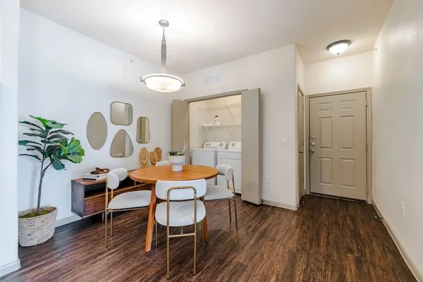 a kitchen with granite countertop a sink a counter space appliances and cabinets