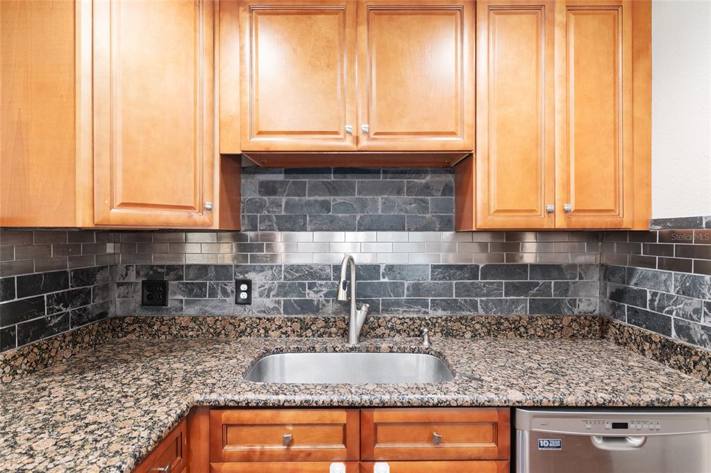 630 Northwest 34th Street Gainesville, FL 32607 - Photo 18 of 84 a kitchen with sink a window and cabinets