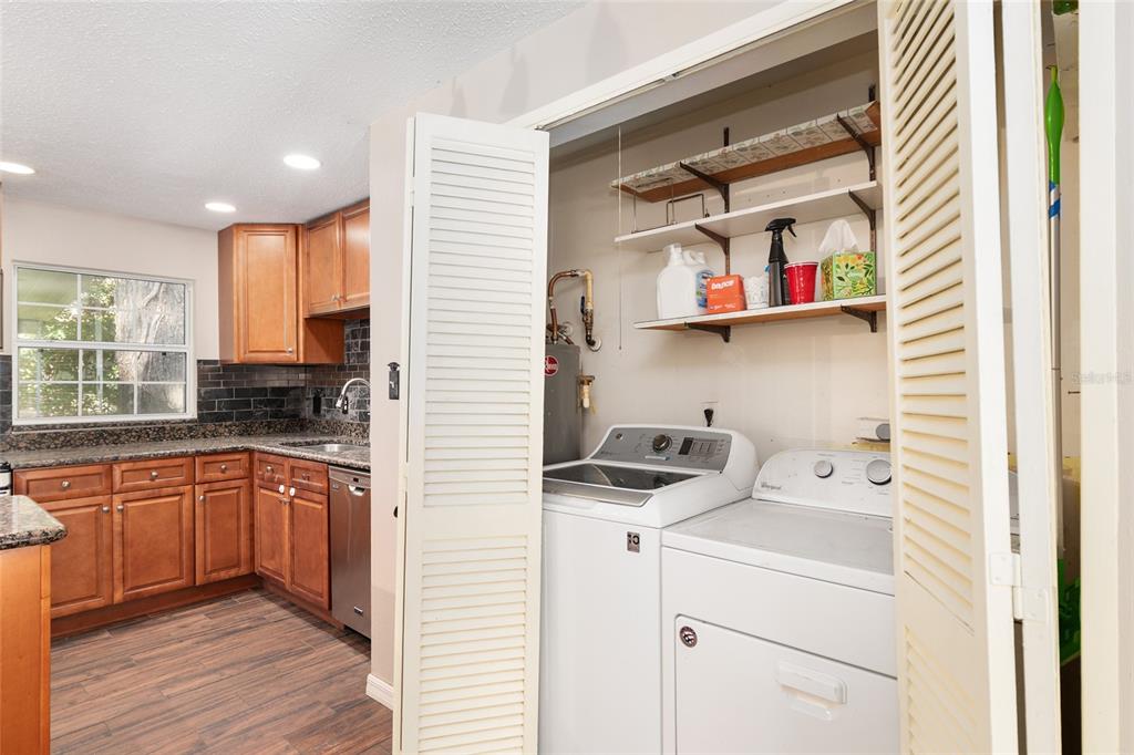 630 Northwest 34th Street Gainesville, FL 32607 - Photo 19 of 84 a kitchen with a cabinets and wooden floor