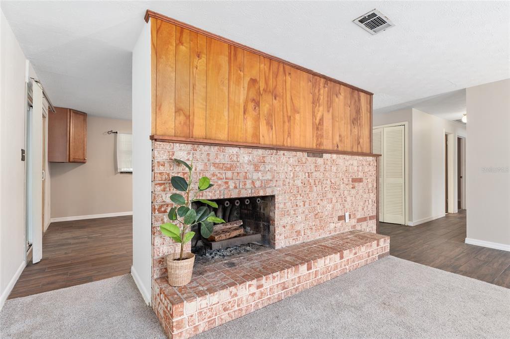 630 Northwest 34th Street Gainesville, FL 32607 - Photo 3 of 84 a view of a livingroom with a fireplace and a window