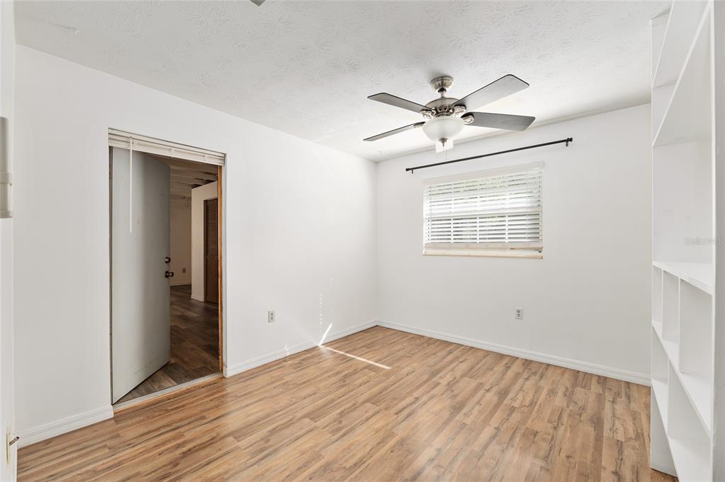 630 Northwest 34th Street Gainesville, FL 32607 - Photo 32 of 84 wooden floor in an empty room with a window