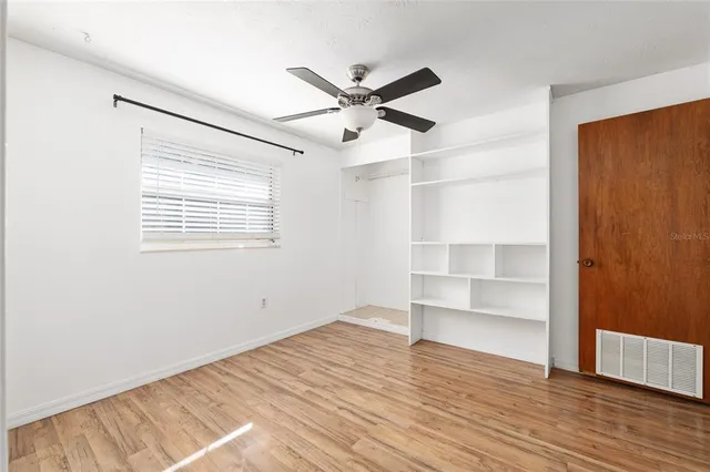 a kitchen with stainless steel appliances granite countertop a refrigerator and a stove