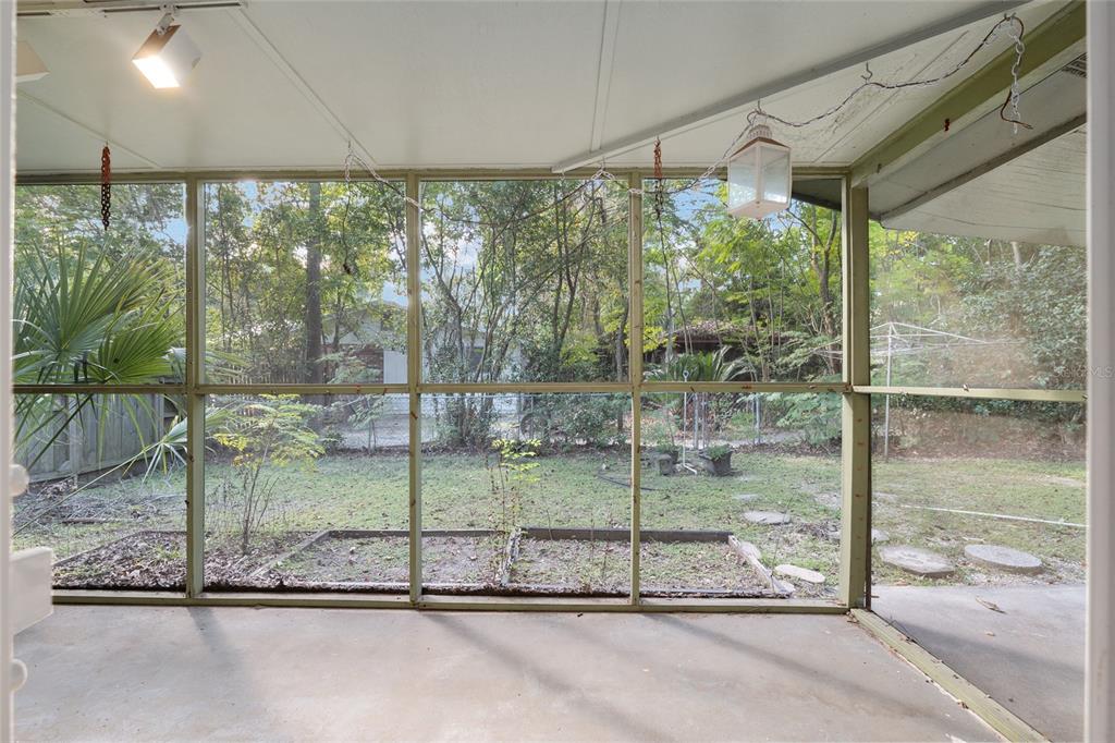630 Northwest 34th Street Gainesville, FL 32607 - Photo 37 of 84 a room with a garden view