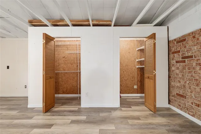 a view of a porch with wooden floor and a backyard