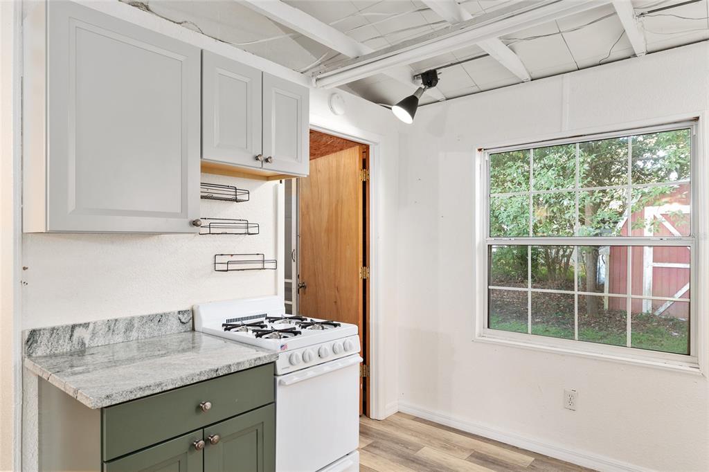 630 Northwest 34th Street Gainesville, FL 32607 - Photo 46 of 84 a kitchen with stainless steel appliances granite countertop a refrigerator and a stove