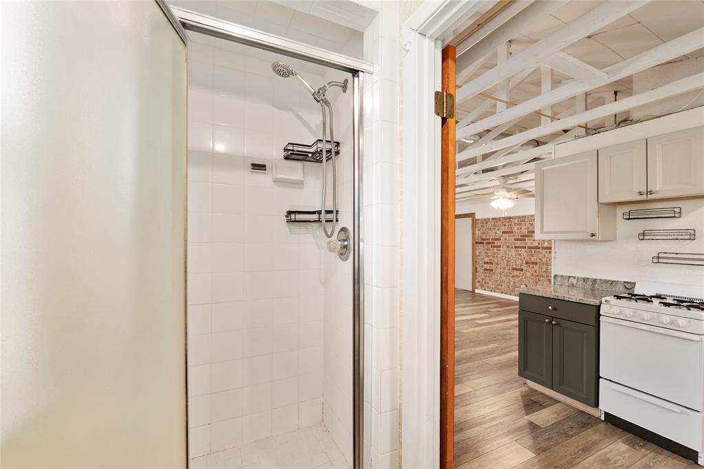 630 Northwest 34th Street Gainesville, FL 32607 - Photo 50 of 84 a view of a kitchen with a refrigerator and cabinets