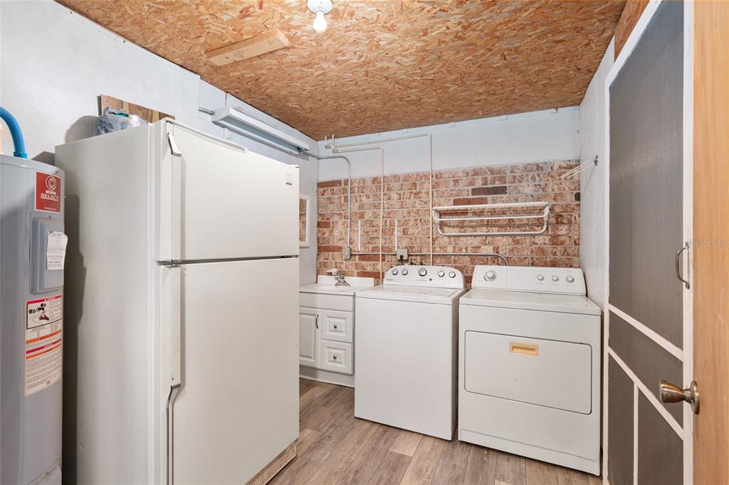 630 Northwest 34th Street Gainesville, FL 32607 - Photo 51 of 84 a utility room with dryer and washer