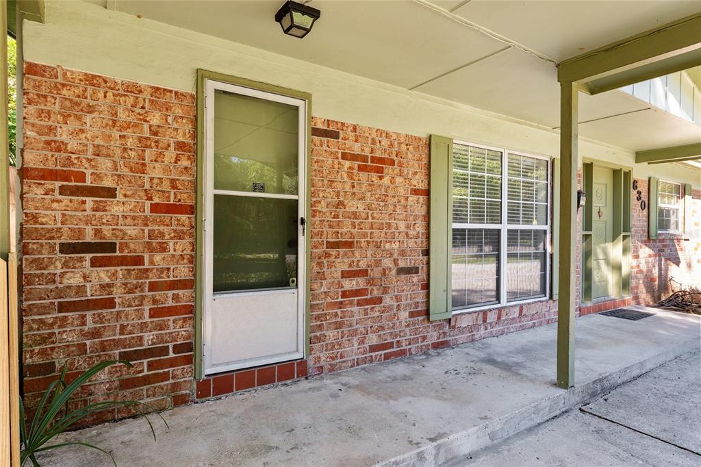 630 Northwest 34th Street Gainesville, FL 32607 - Photo 57 of 84 front view of a brick house with a outdoor space