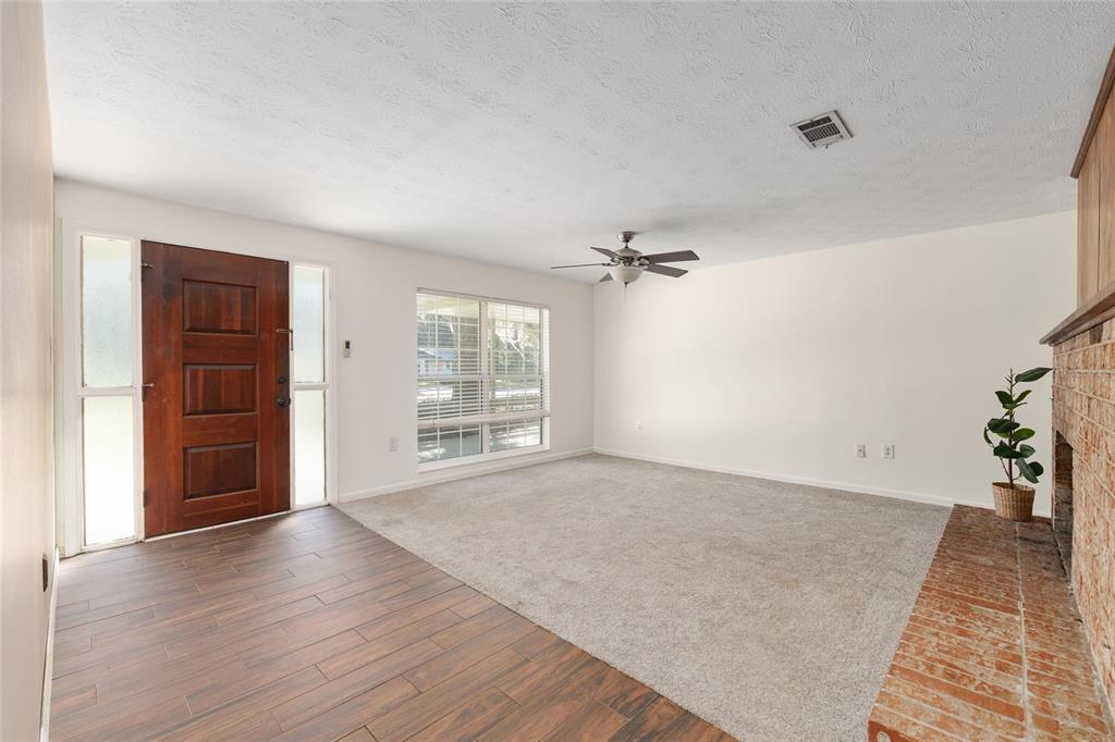 630 Northwest 34th Street Gainesville, FL 32607 - Photo 8 of 84 wooden floor in an empty room with a window