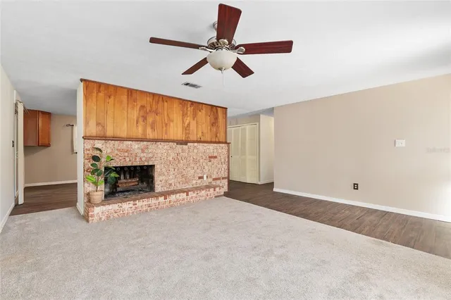 a kitchen with granite countertop a sink stainless steel appliances and cabinets