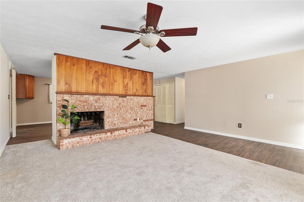 630 Northwest 34th Street Gainesville, FL 32607 - Photo 9 of 84 a view of an empty room with fireplace and a window