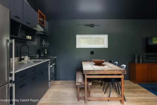 a kitchen with a table and chairs in it