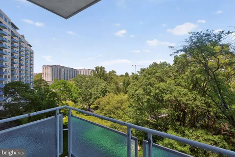 a view of a balcony with an outdoor space