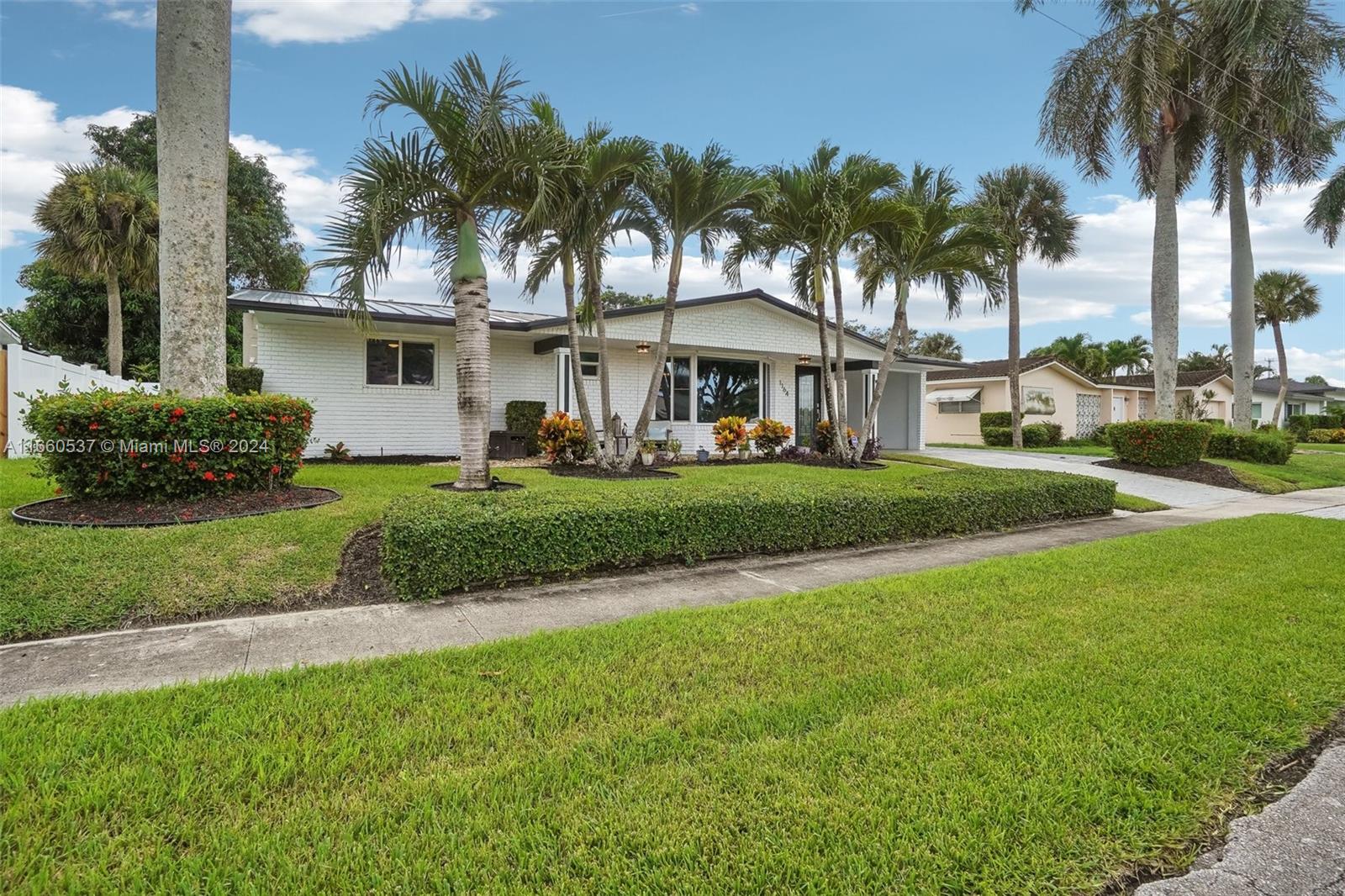 1164 Southwest 14th Street Boca Raton, FL 33486 - Photo 2 of 54 Palm trees lined front of home