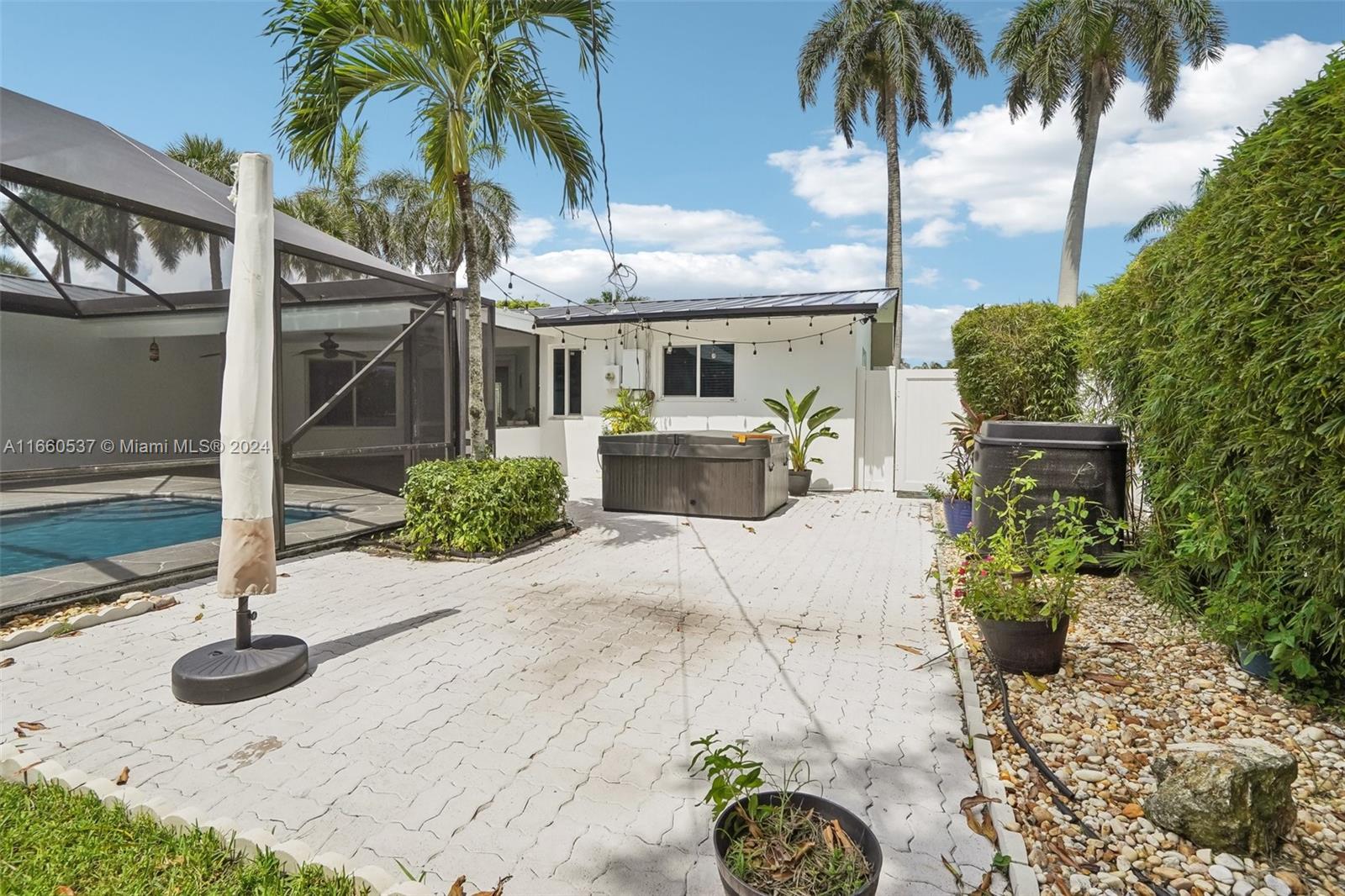 1164 Southwest 14th Street Boca Raton, FL 33486 - Photo 45 of 54 Spa outside pool cage and room for BBQ grill