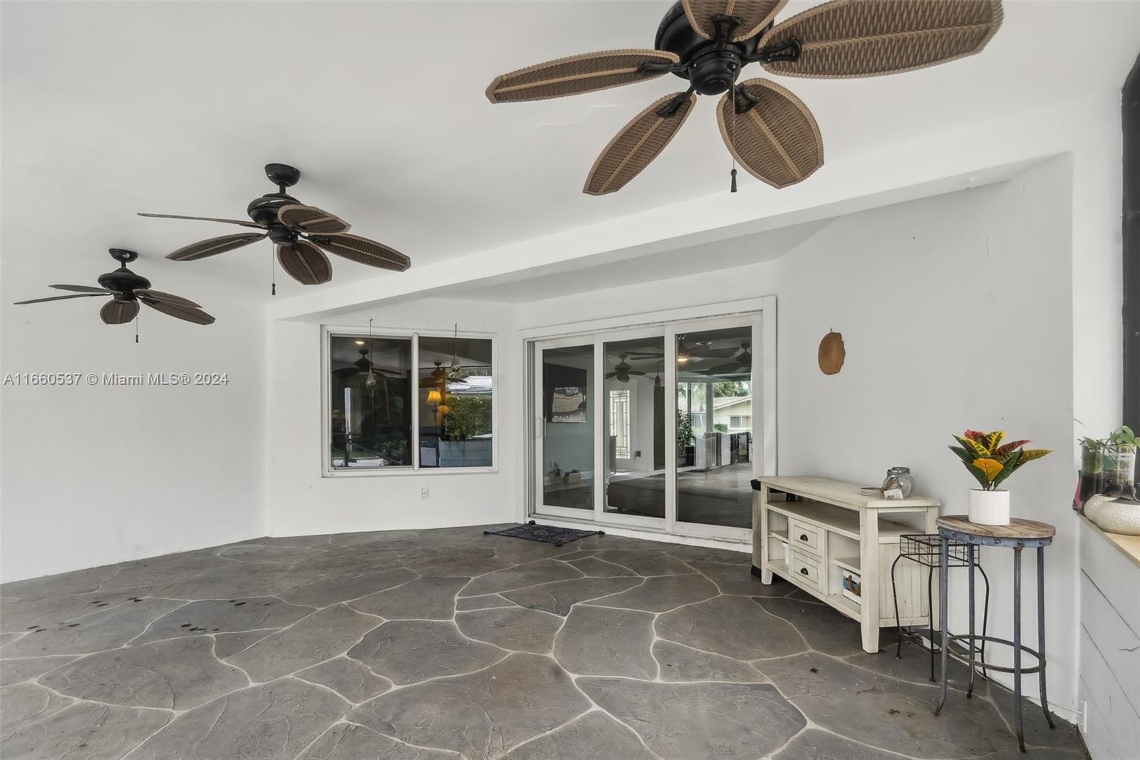 1164 Southwest 14th Street Boca Raton, FL 33486 - Photo 9 of 54 Covered lanai with three fans