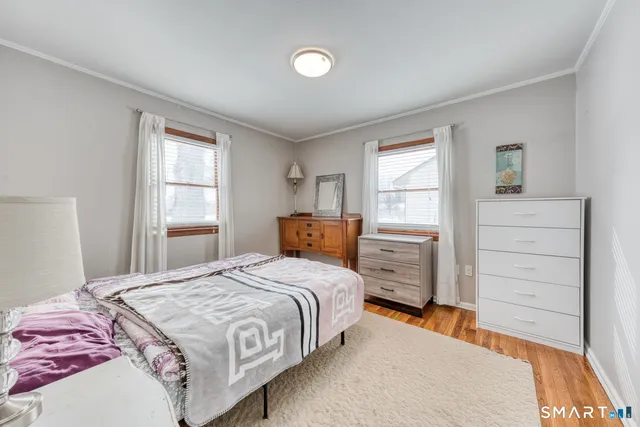 a room that has a bed and a table in it