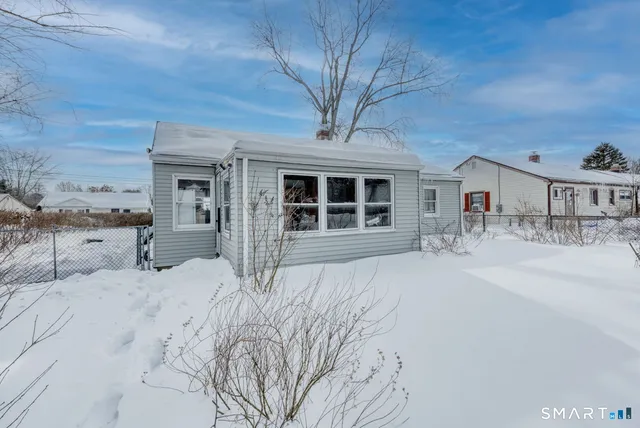a view of a yard and a house